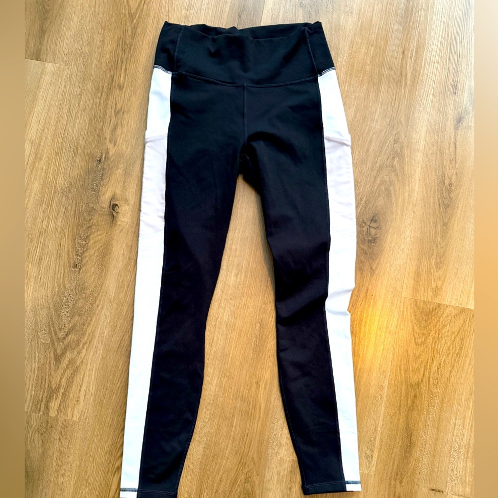 Fabletic’s High Waist Power Hold leggings. Black and white with side pockets